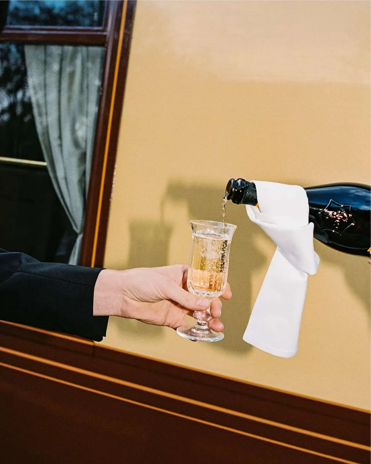 Wedding celebration champagne service beside British Pullman